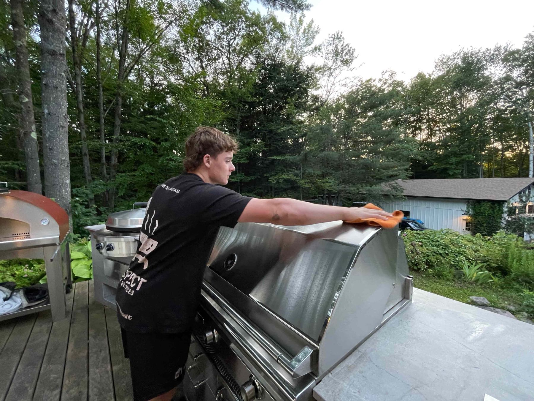 Aspect technician detailing a built-in grill